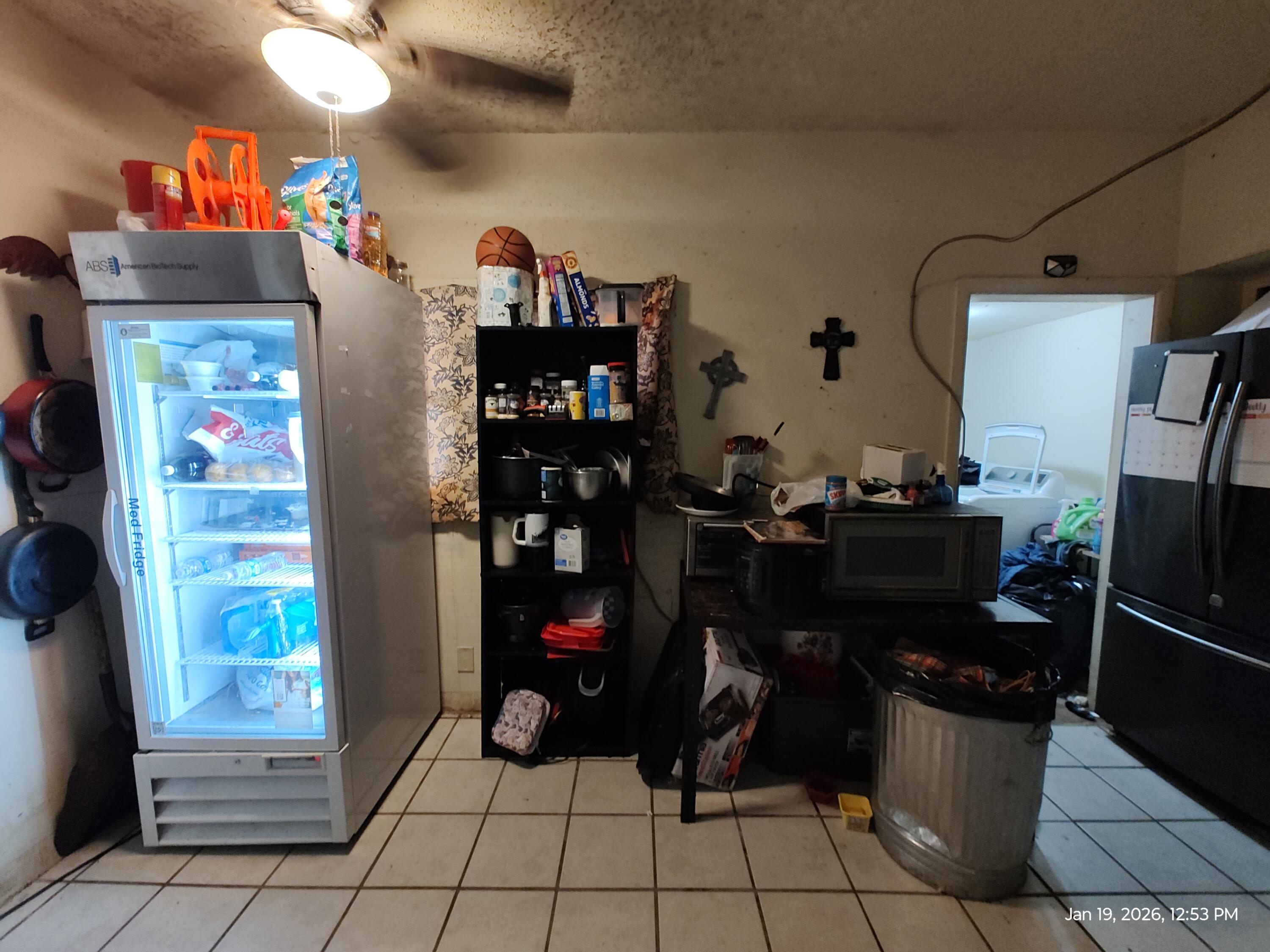 5710 F M 1294 Lubbock, TX 79415 - Photo 5 of 12 a kitchen with refrigerator and cabinets
