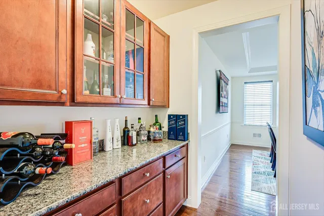 a kitchen with granite countertop cabinets and stove top oven