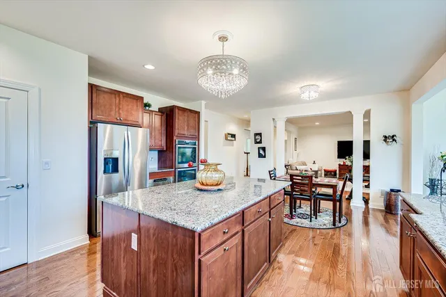 a bedroom with a bed and a lamp