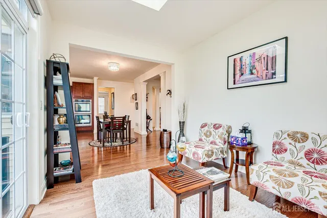a view of entryway with wooden floor and stairs