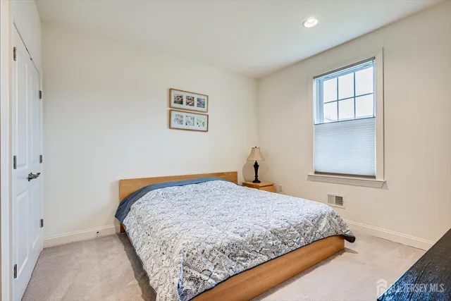 a bathroom with a tub sink shower and mirror