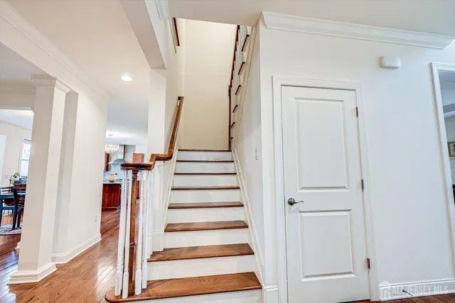 a bedroom with a bed and a night stand