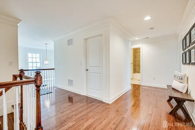 a bedroom with a bed and a night stand