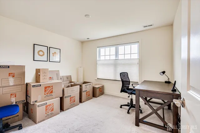 a view of a white house with a big yard and large trees