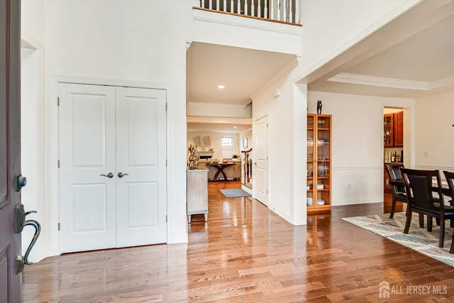 a kitchen with stainless steel appliances granite countertop a sink dishwasher and cabinets with wooden floor