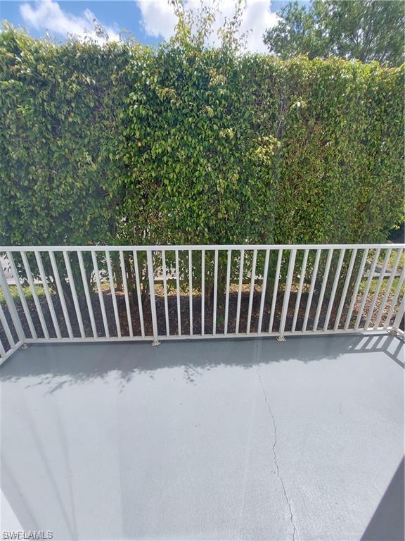 3268 Amanda Lane, Unit 3 Naples, FL 34109 - Photo 12 of 26 a view of a chair in a roof deck
