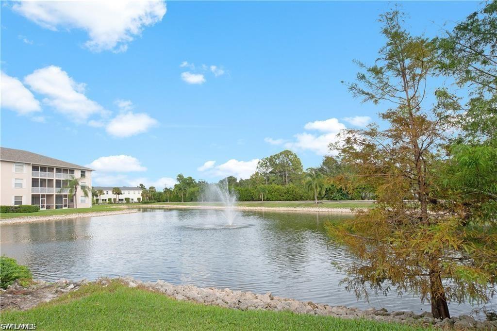 3268 Amanda Lane, Unit 3 Naples, FL 34109 - Photo 2 of 26 a view of a lake with a big yard