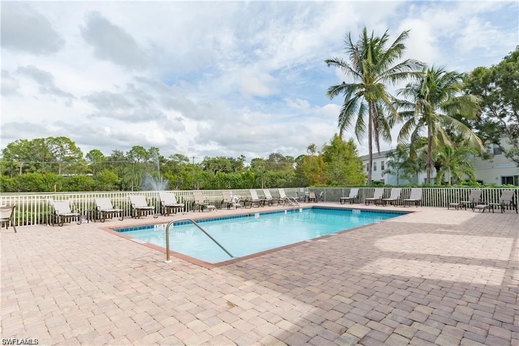 3268 Amanda Lane, Unit 3 Naples, FL 34109 - Photo 3 of 26 a view of a swimming pool with a lake