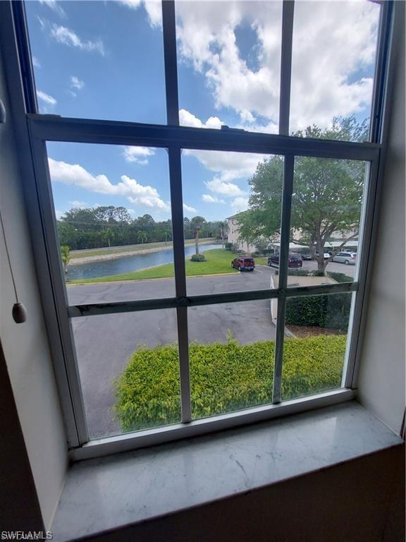 3268 Amanda Lane, Unit 3 Naples, FL 34109 - Photo 7 of 26 a view of a room with wooden floor and a porch