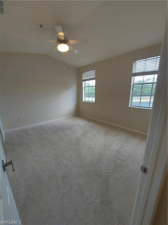 3268 Amanda Lane, Unit 3 Naples, FL 34109 - Photo 9 of 26 an empty room with windows