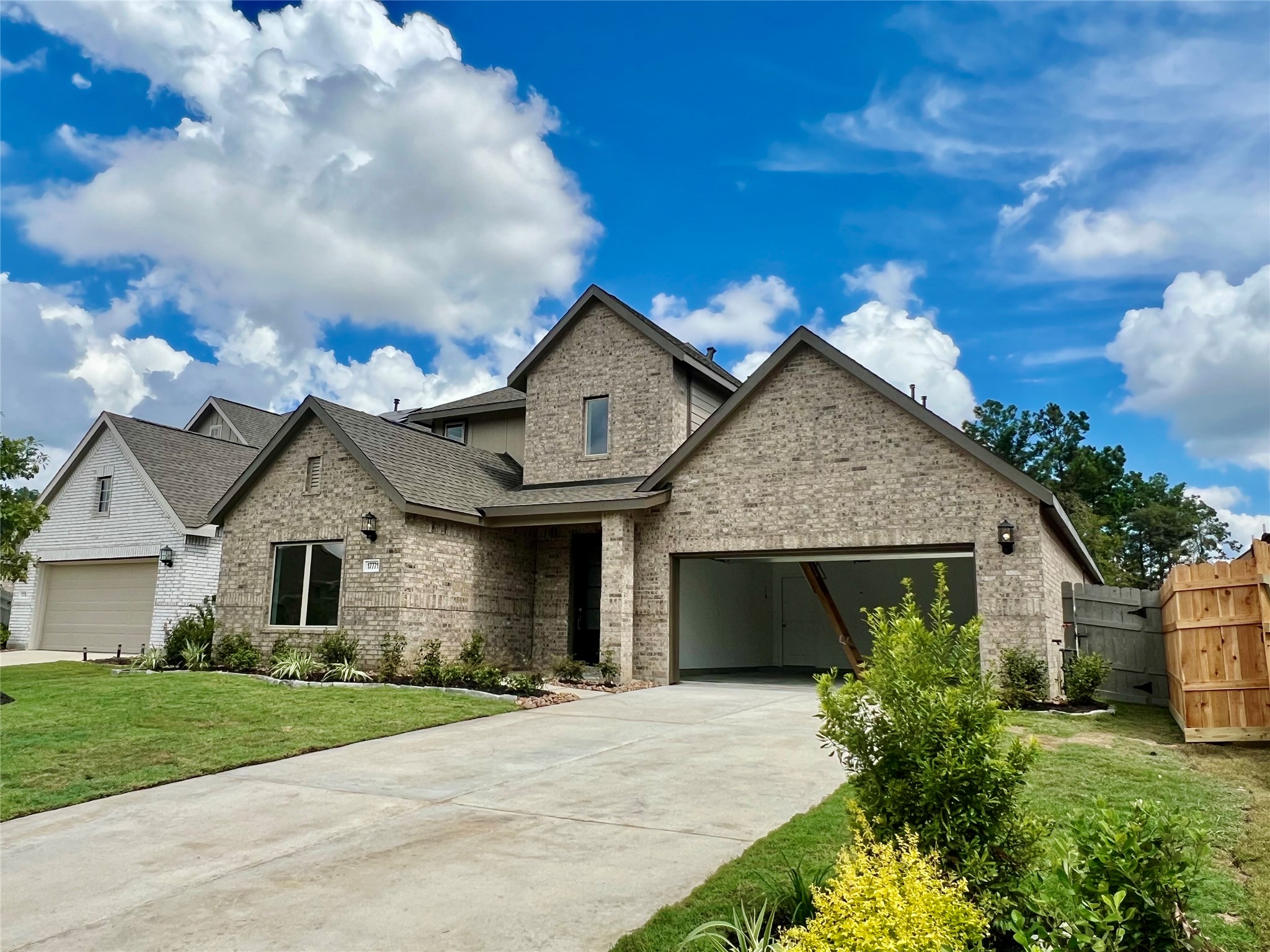 17771 Misty Brk Lane Conroe, TX 77302 - Photo 1 of 48 a front view of a house with garden