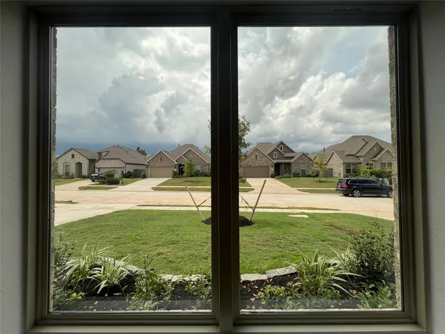 a view of swimming pool from a window