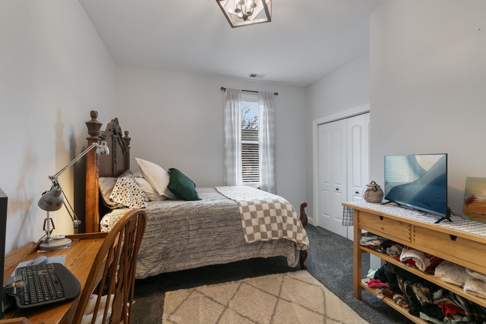 3239 Wesley Avenue Berwyn, IL 60402 - Photo 14 of 29 a bedroom with a bed and a flat screen tv