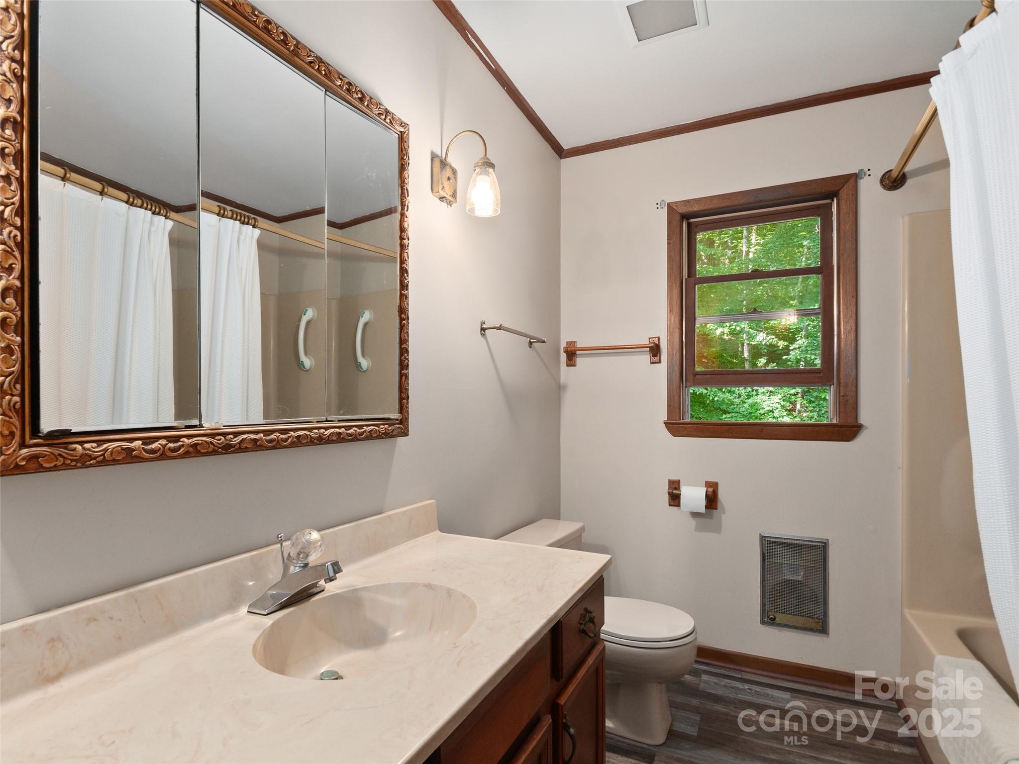 250 Turkey Pen Road Franklin, NC 28734 - Photo 16 of 30 a bathroom with a sink toilet and shower
