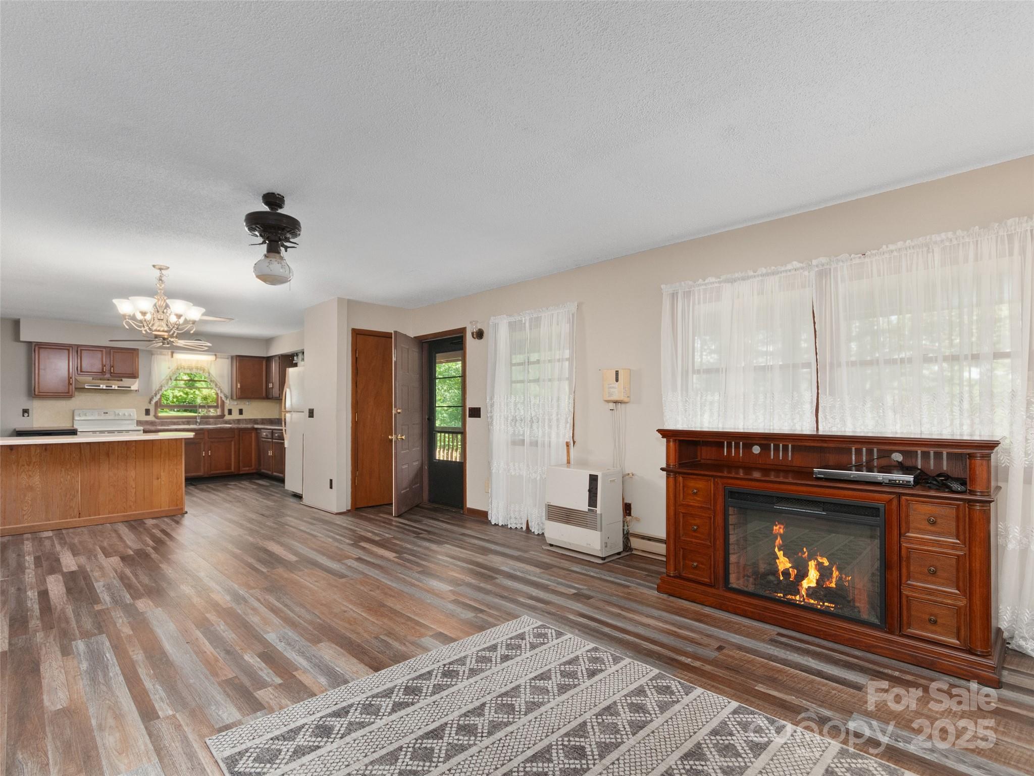 250 Turkey Pen Road Franklin, NC 28734 - Photo 10 of 30 a living room with furniture and a fireplace