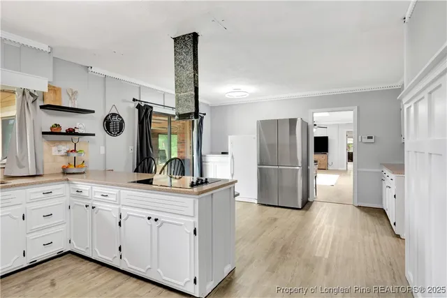 a kitchen with a refrigerator and a sink