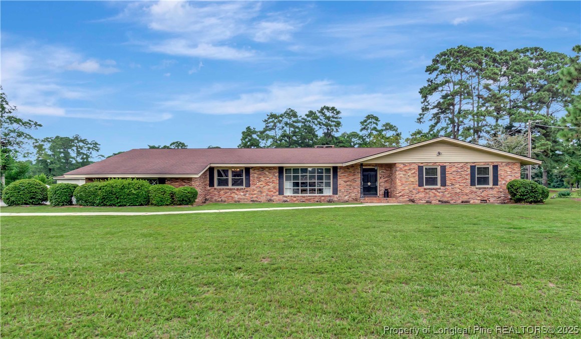 12073 Highway 130 Fairmont, NC 28340 - Photo 2 of 45 a front view of a house with garden