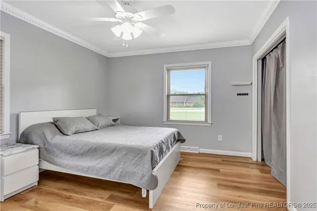 a spacious bedroom with a bed and a window