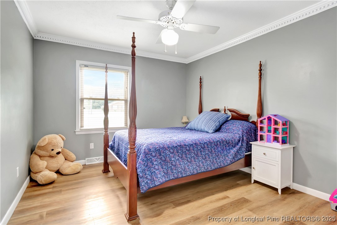12073 Highway 130 Fairmont, NC 28340 - Photo 29 of 45 a bedroom with a bed and window