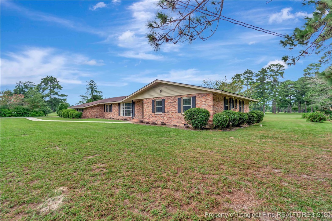 12073 Highway 130 Fairmont, NC 28340 - Photo 3 of 45 a view of a house with a yard