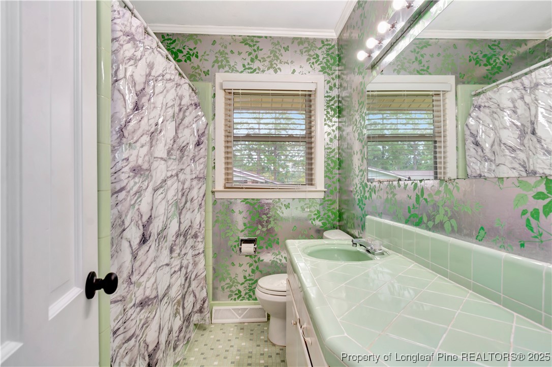 12073 Highway 130 Fairmont, NC 28340 - Photo 31 of 45 a bath room with a toilet and a shower