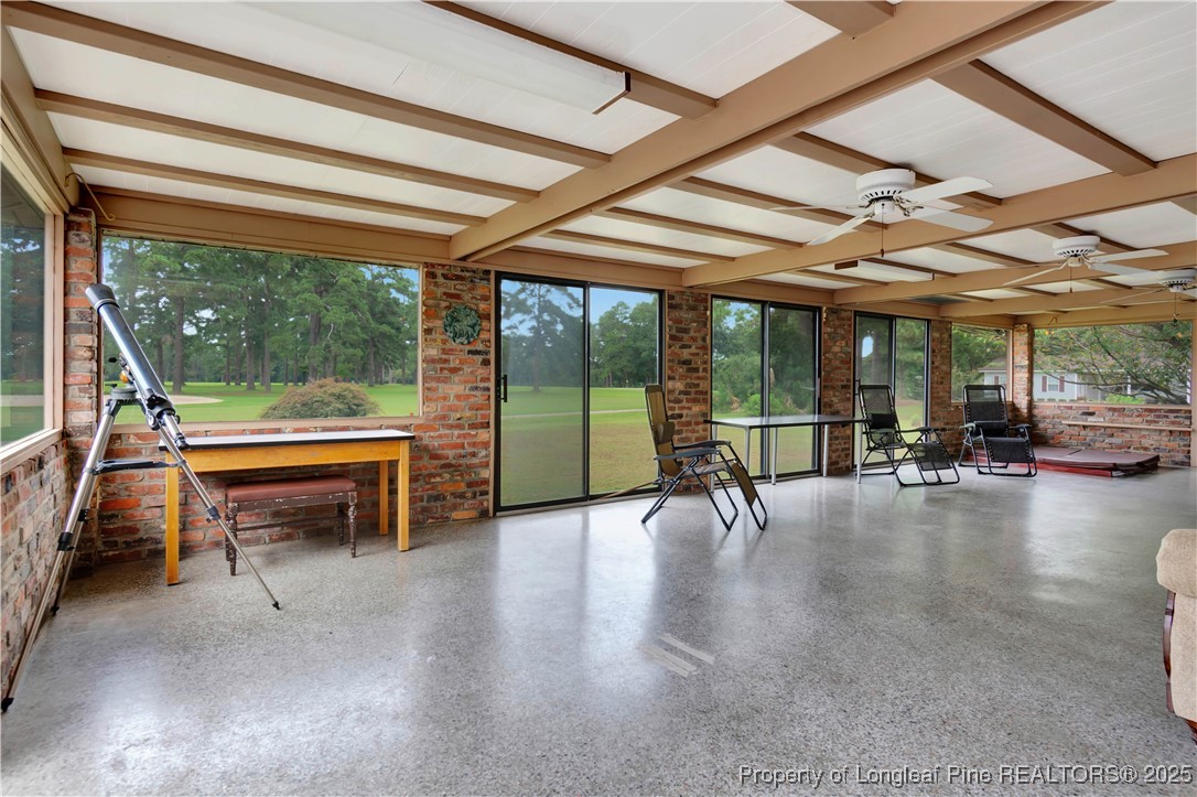 12073 Highway 130 Fairmont, NC 28340 - Photo 35 of 45 a view of a patio with table and chairs next to a yard
