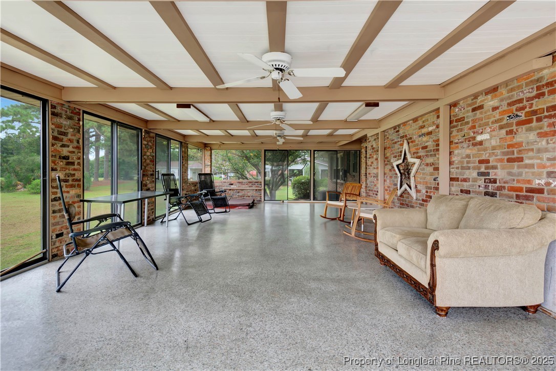 12073 Highway 130 Fairmont, NC 28340 - Photo 36 of 45 a living room with furniture and a chandelier