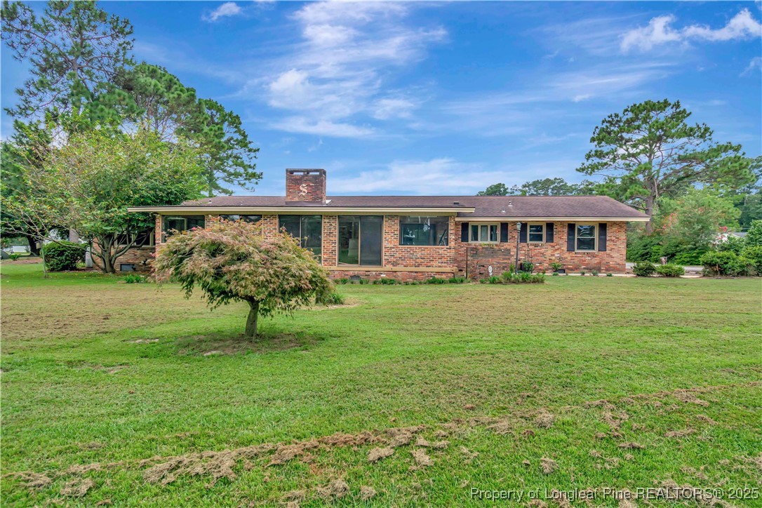 12073 Highway 130 Fairmont, NC 28340 - Photo 41 of 45 a view of house with a yard