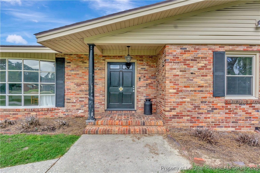 12073 Highway 130 Fairmont, NC 28340 - Photo 5 of 45 a front view of a house with a yard