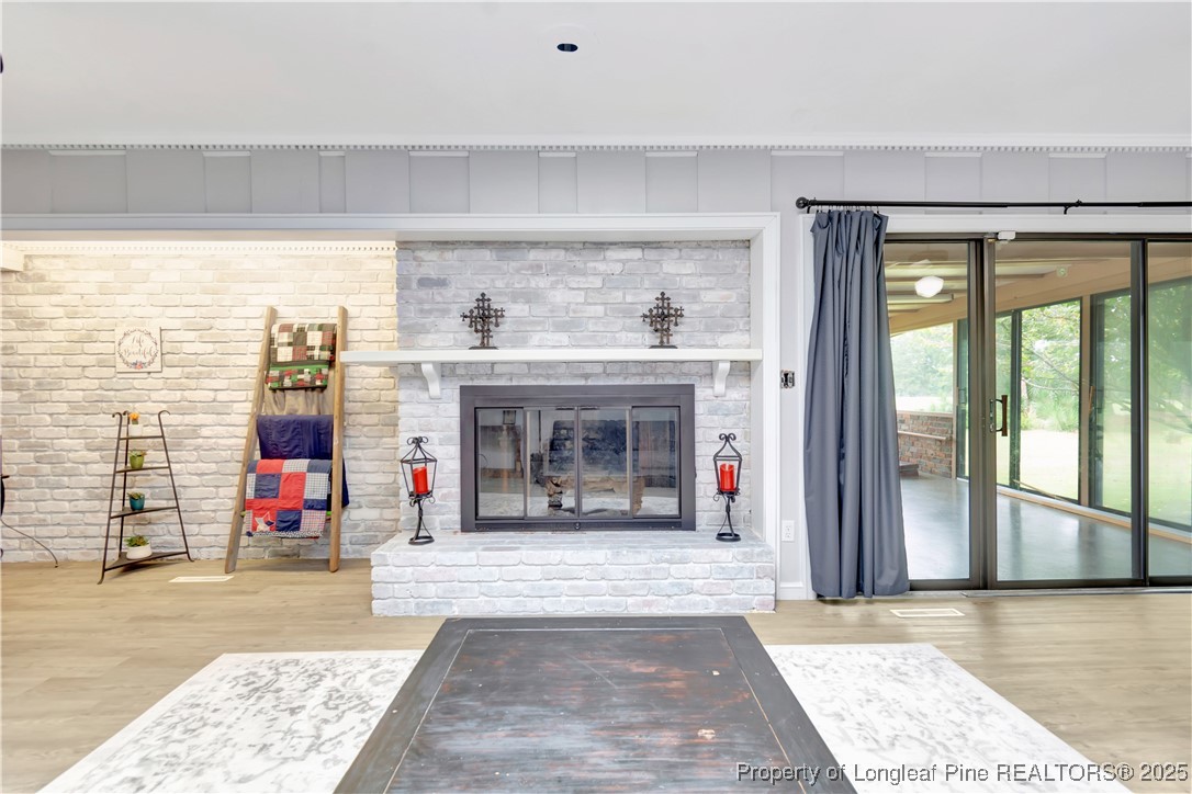 12073 Highway 130 Fairmont, NC 28340 - Photo 9 of 45 a living room with fireplace furniture and a window