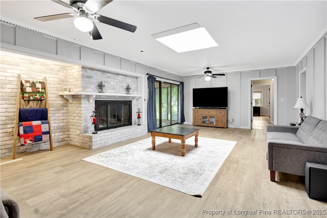 12073 Highway 130 Fairmont, NC 28340 - Photo 10 of 45 a living room with furniture and a flat screen tv