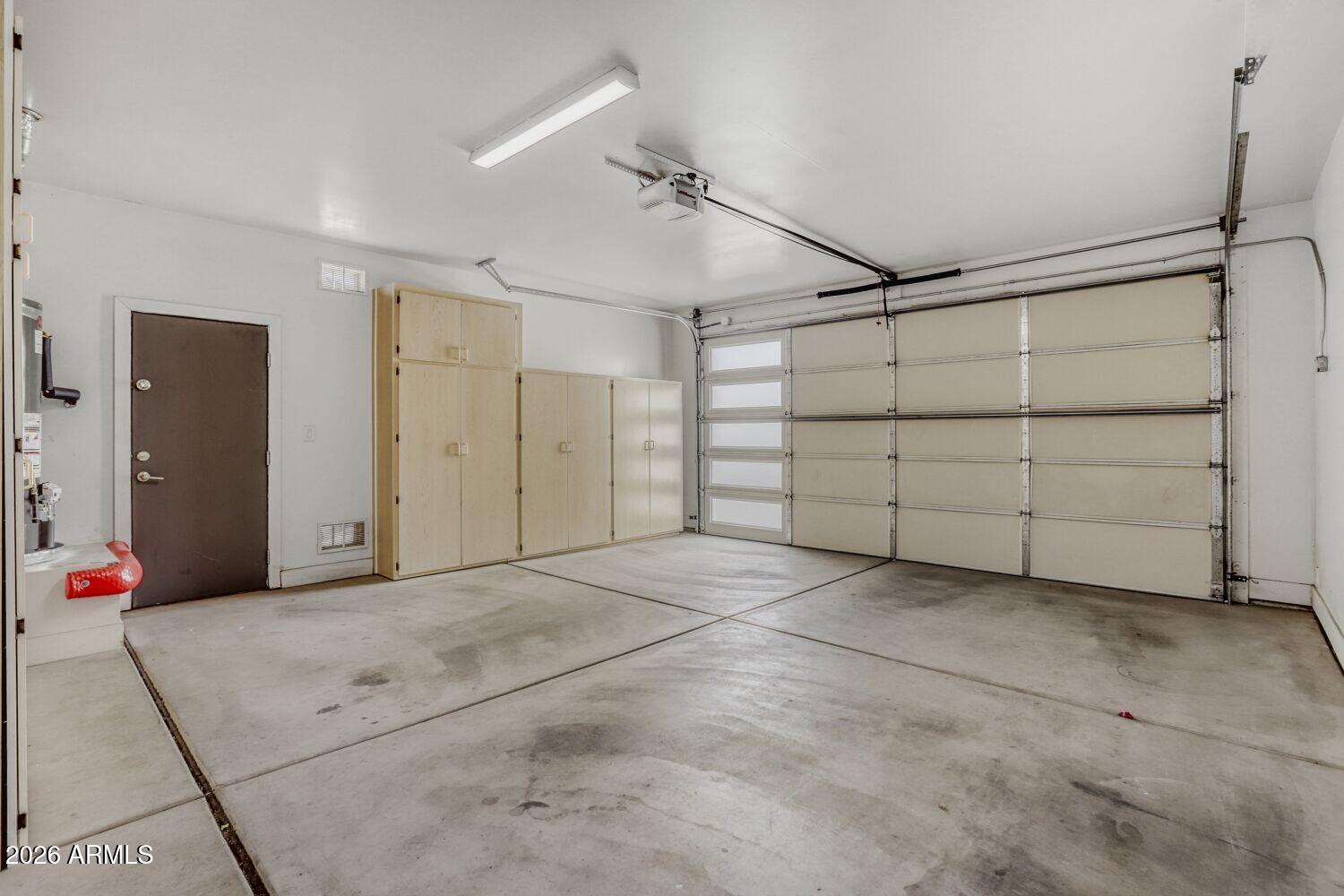 1005 East Weldon Avenue Phoenix, AZ 85014 - Photo 27 of 33 Garage with Storage Cabinets