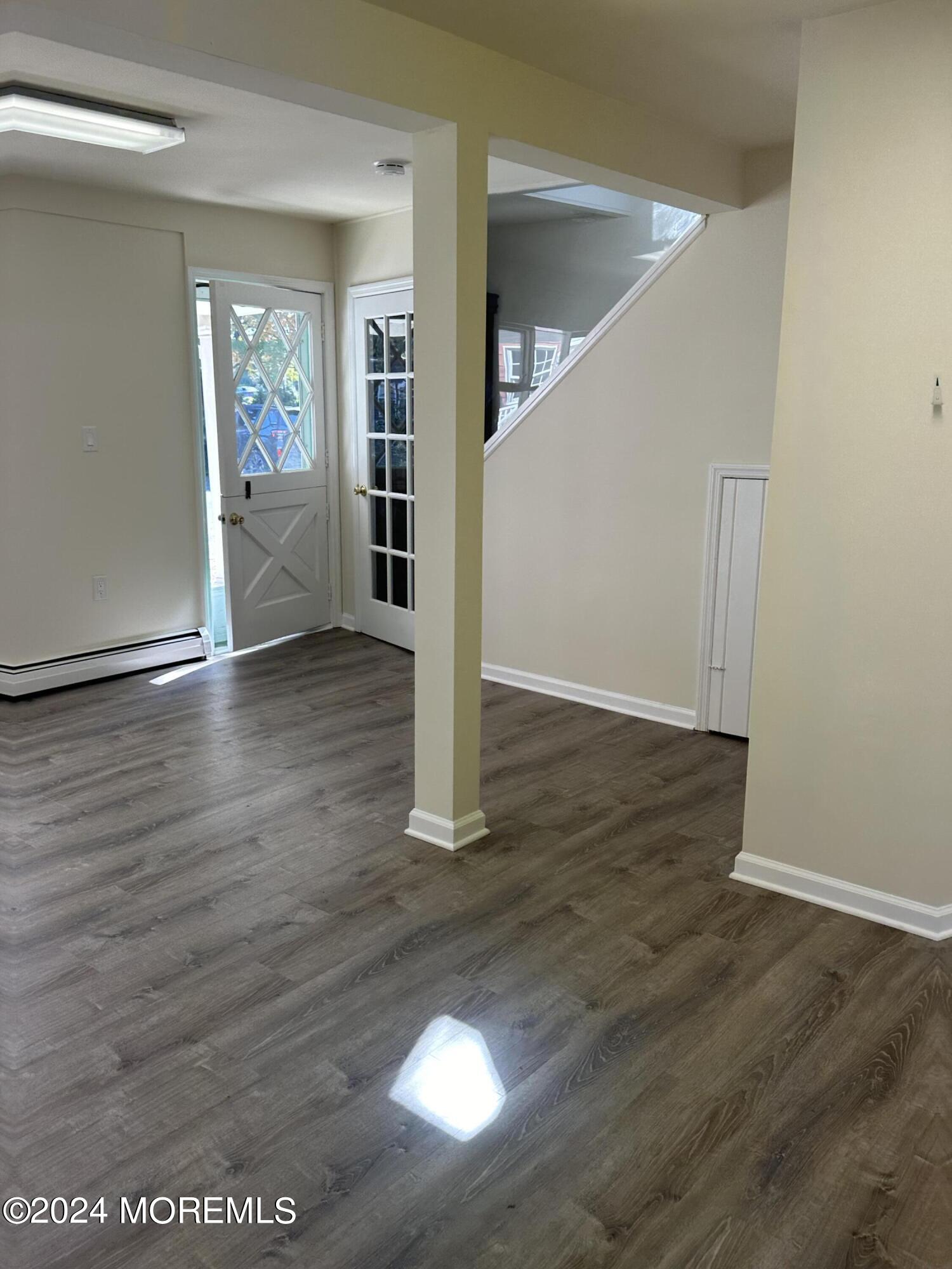 1 Leonardville Road, Unit C Middletown, NJ 07748 - Photo 7 of 12 a view of entryway with wooden floor