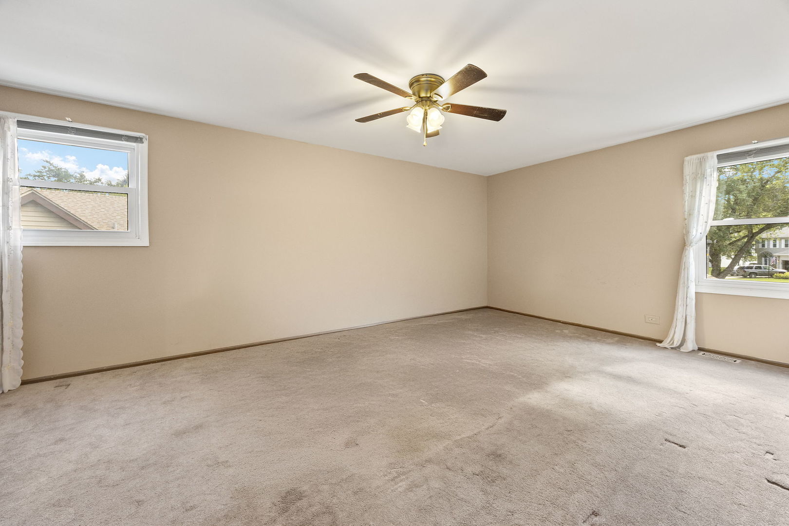 2044 Templar Drive Naperville, IL 60565 - Photo 14 of 28 an empty room with windows and fan view