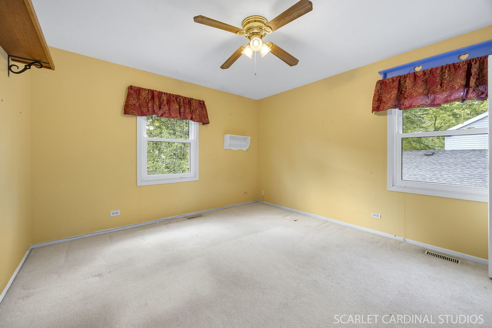 2044 Templar Drive Naperville, IL 60565 - Photo 19 of 28 an empty room with windows and a ceiling fan