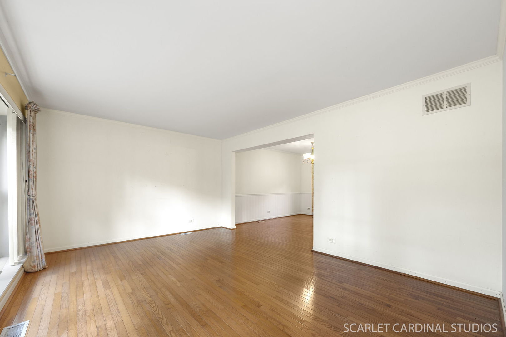 2044 Templar Drive Naperville, IL 60565 - Photo 3 of 28 an empty room with wooden floor and windows