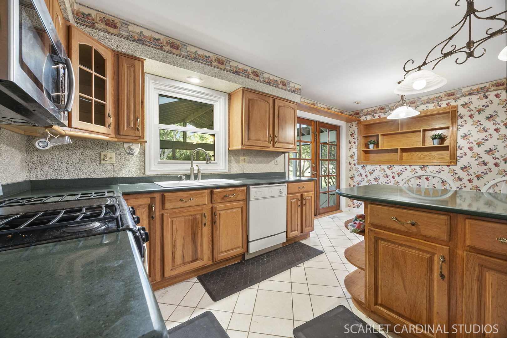 2044 Templar Drive Naperville, IL 60565 - Photo 6 of 28 a kitchen with stainless steel appliances granite countertop a stove a sink and a microwave