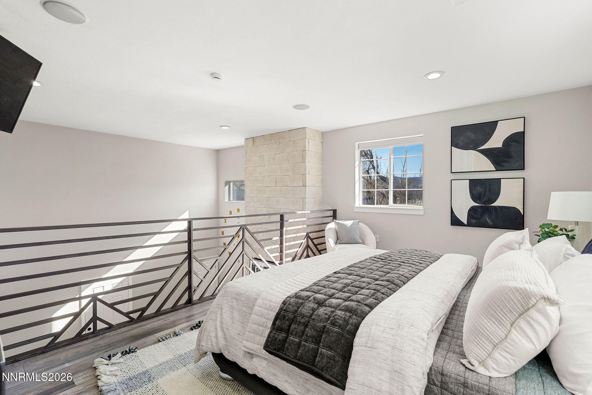 14675 Chamy Drive Reno, NV 89521 - Photo 33 of 86 a bedroom with a bed and a flat tv screen