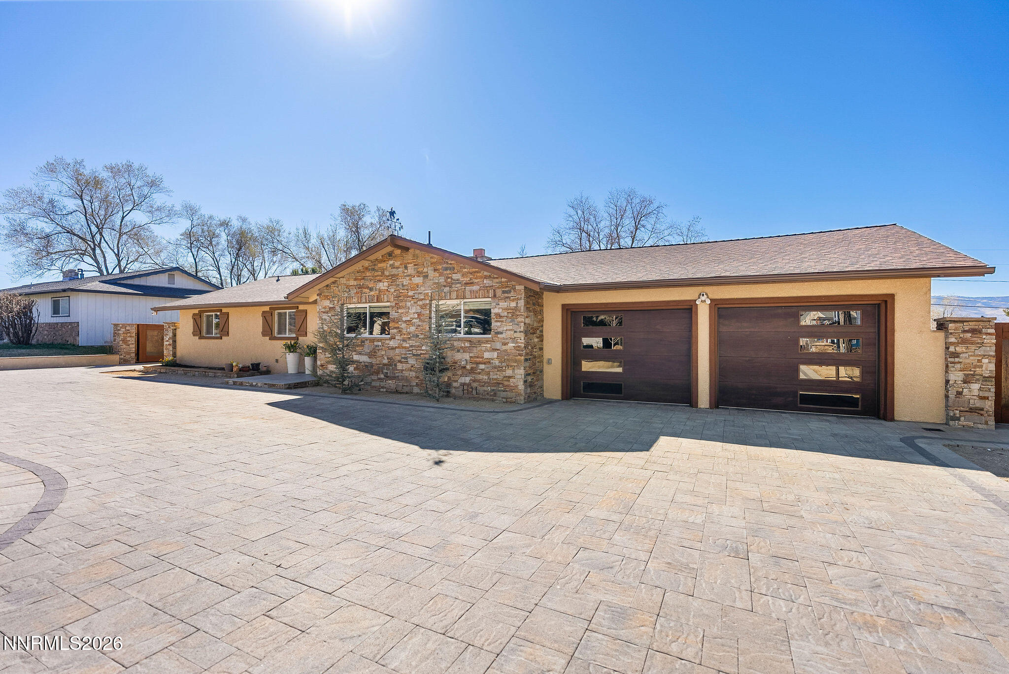 14675 Chamy Drive Reno, NV 89521 - Photo 76 of 86 a front view of a house with a yard and a garage
