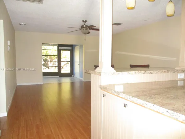 a view of a kitchen cabinets and wooden floor
