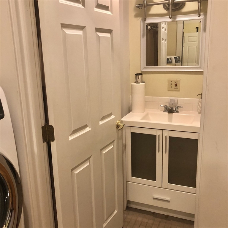 27 High Street, Unit 1 Clinton, MA 01510 - Photo 22 of 30 a bathroom with a sink a toilet and a mirror