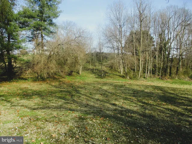 a view of a backyard of the house