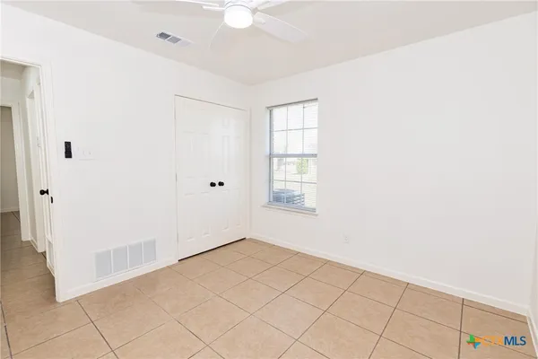 a view of an empty room with window
