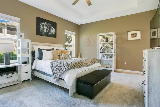 a bedroom with a bed and a couch