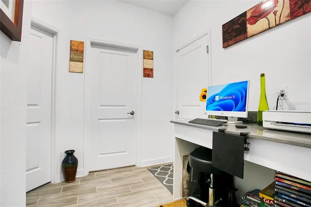a view of workspace with wooden floor