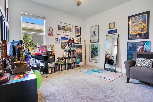 a living room with lots of furniture and toys