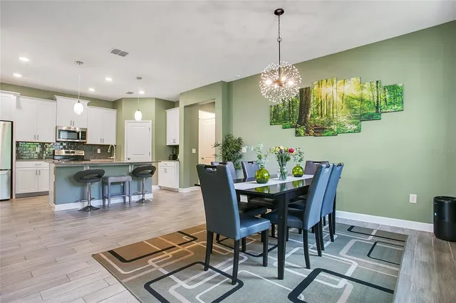 a view of a dining room with furniture