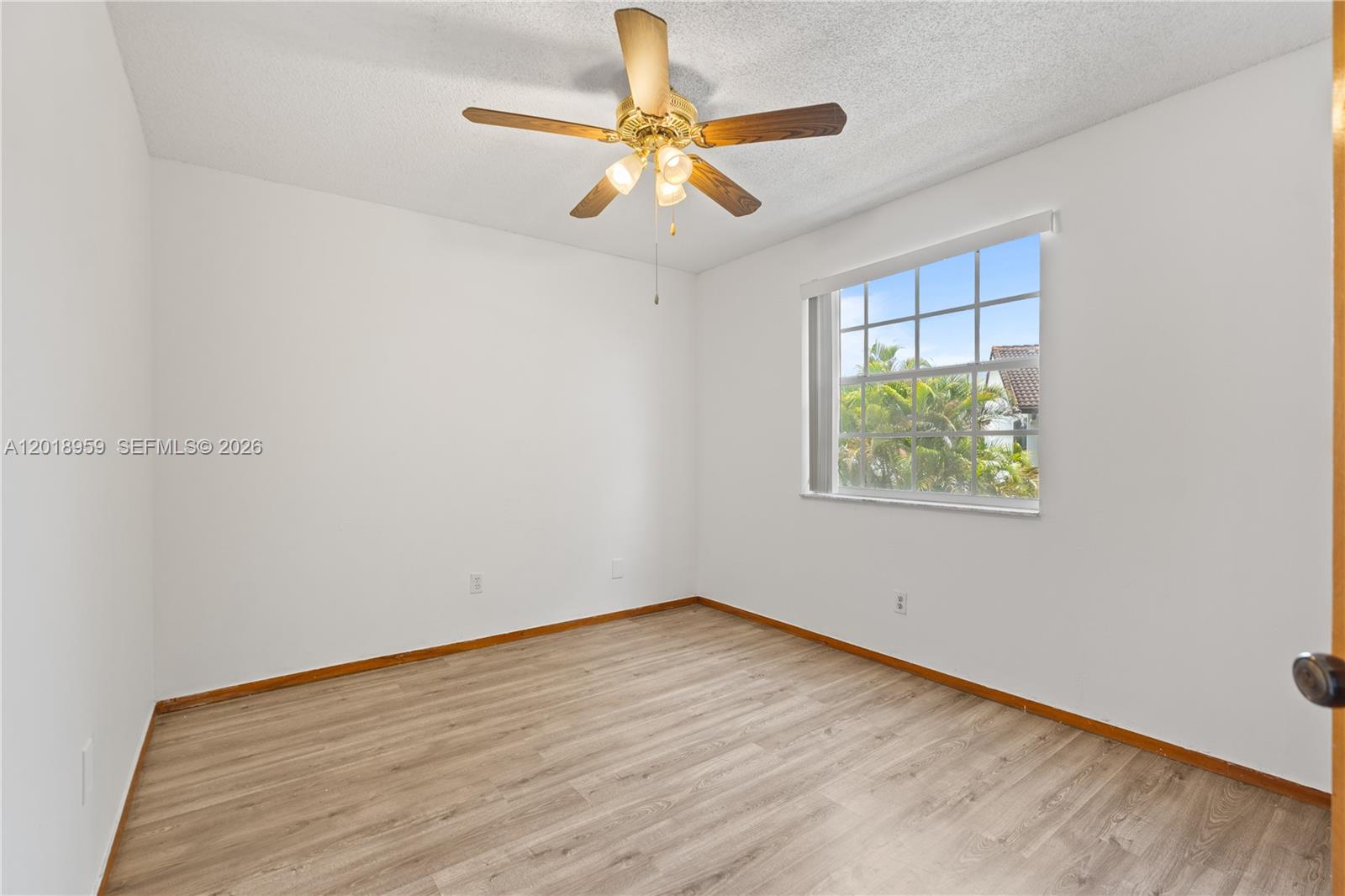 15345 Southwest 63rd Terrace Miami, FL 33193 - Photo 14 of 51 wooden floor in an empty room with a window
