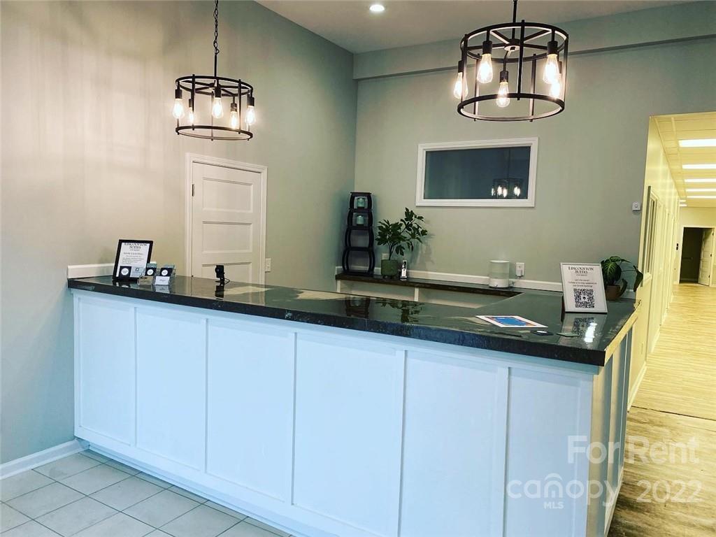 227 East Main Street, Unit SUITE D Lincolnton, NC 28092 - Photo 3 of 4 a bathroom with a sink and a mirror