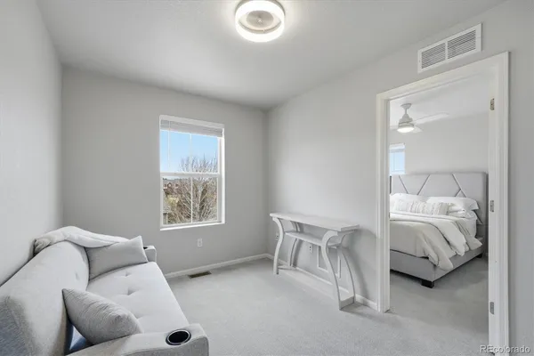 a living room with furniture and a window